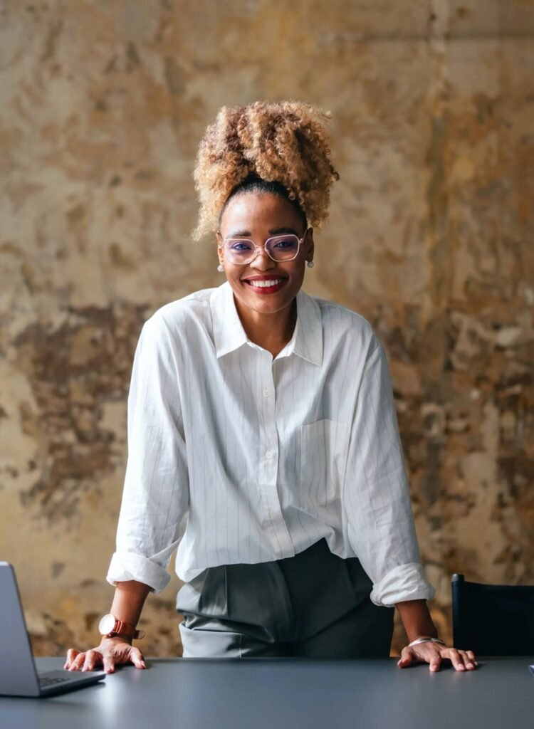 smiling woman in a white button-down shirt